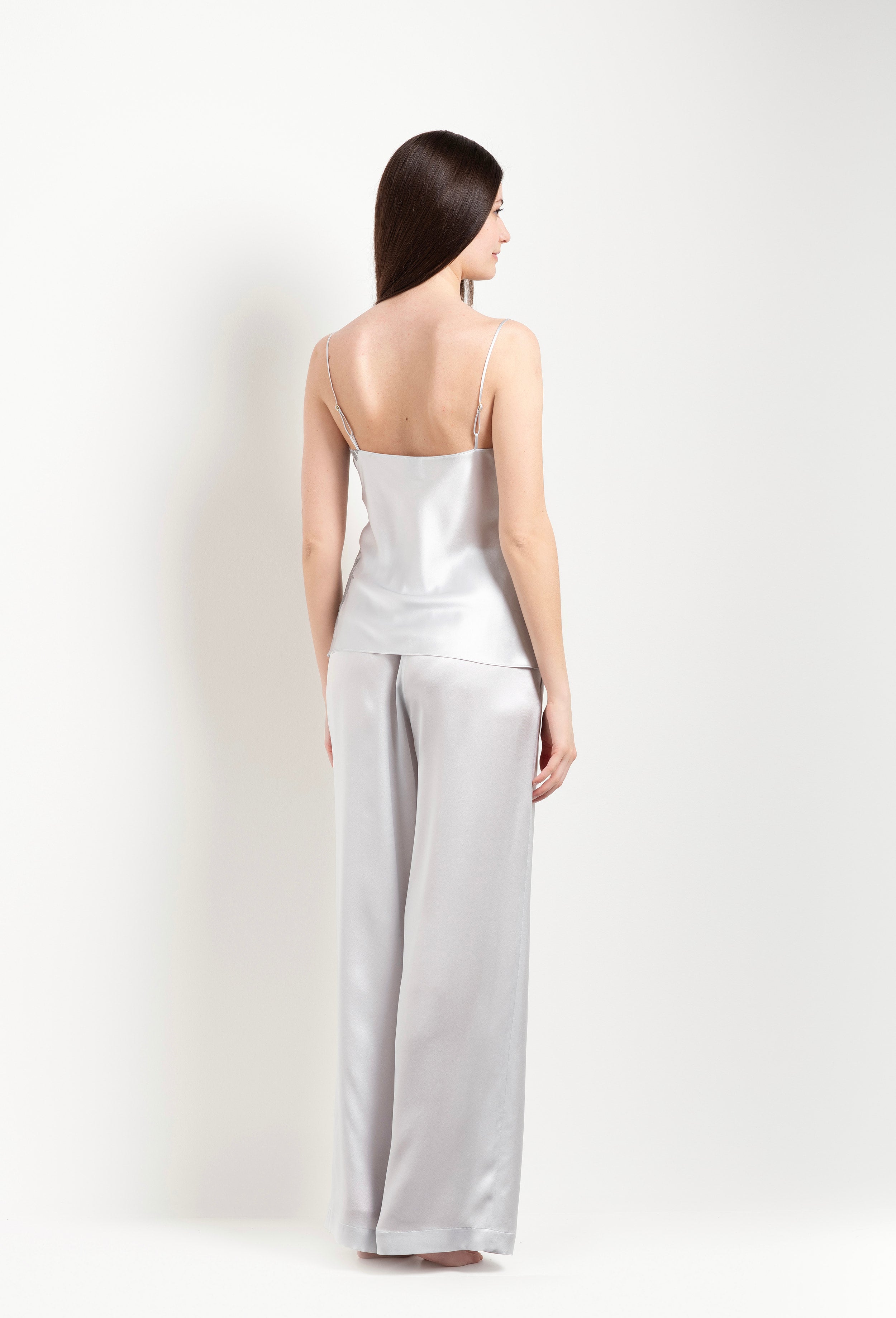 Discover the unique craftmanship of the belgian designer Carine Gilson in her atelier for the Hiver 2026-27 collection with this camisole straight neckline in silver grey silk with grey lace