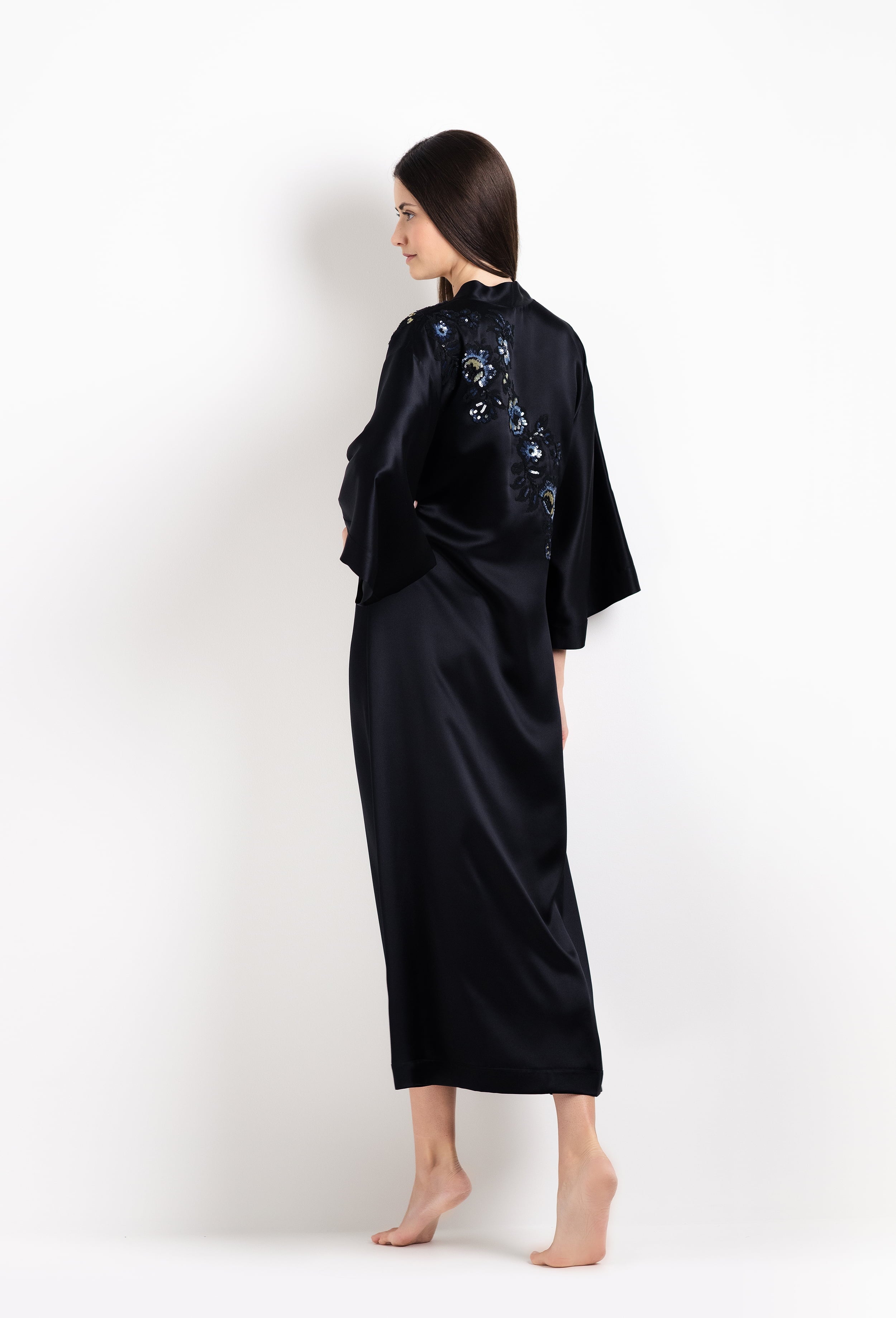 Enter Carine Gilson's world and the most beautiful silk and lace collection with the 2026 Cruise with this Long V Neck Kaftan in black Silk with Sparkling black lace