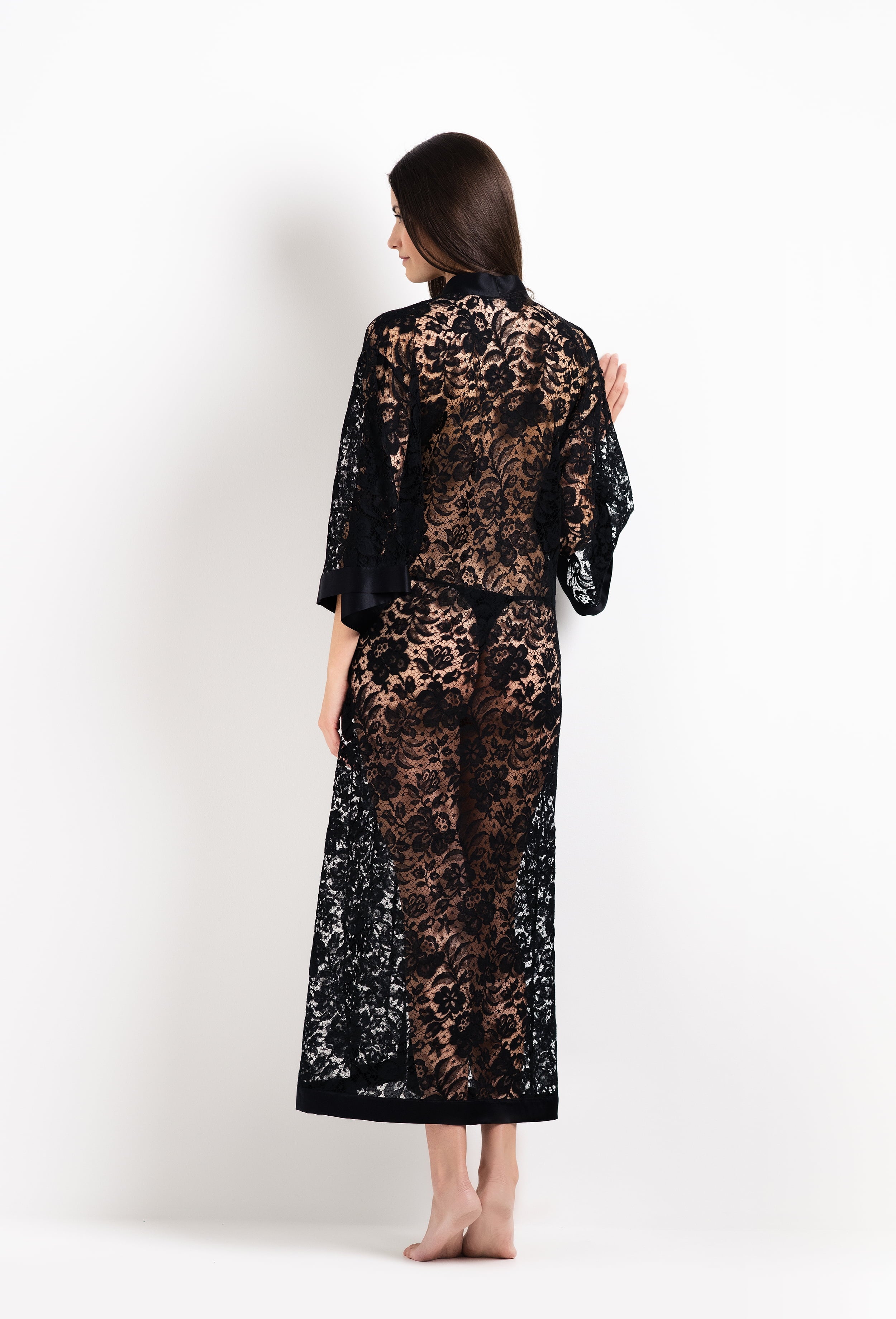 Discover the unique craftmanship of the belgian designer Carine Gilson in her atelier for the 2026 Cruise collection with this Long V Neck Kaftan in black Silk with black lace