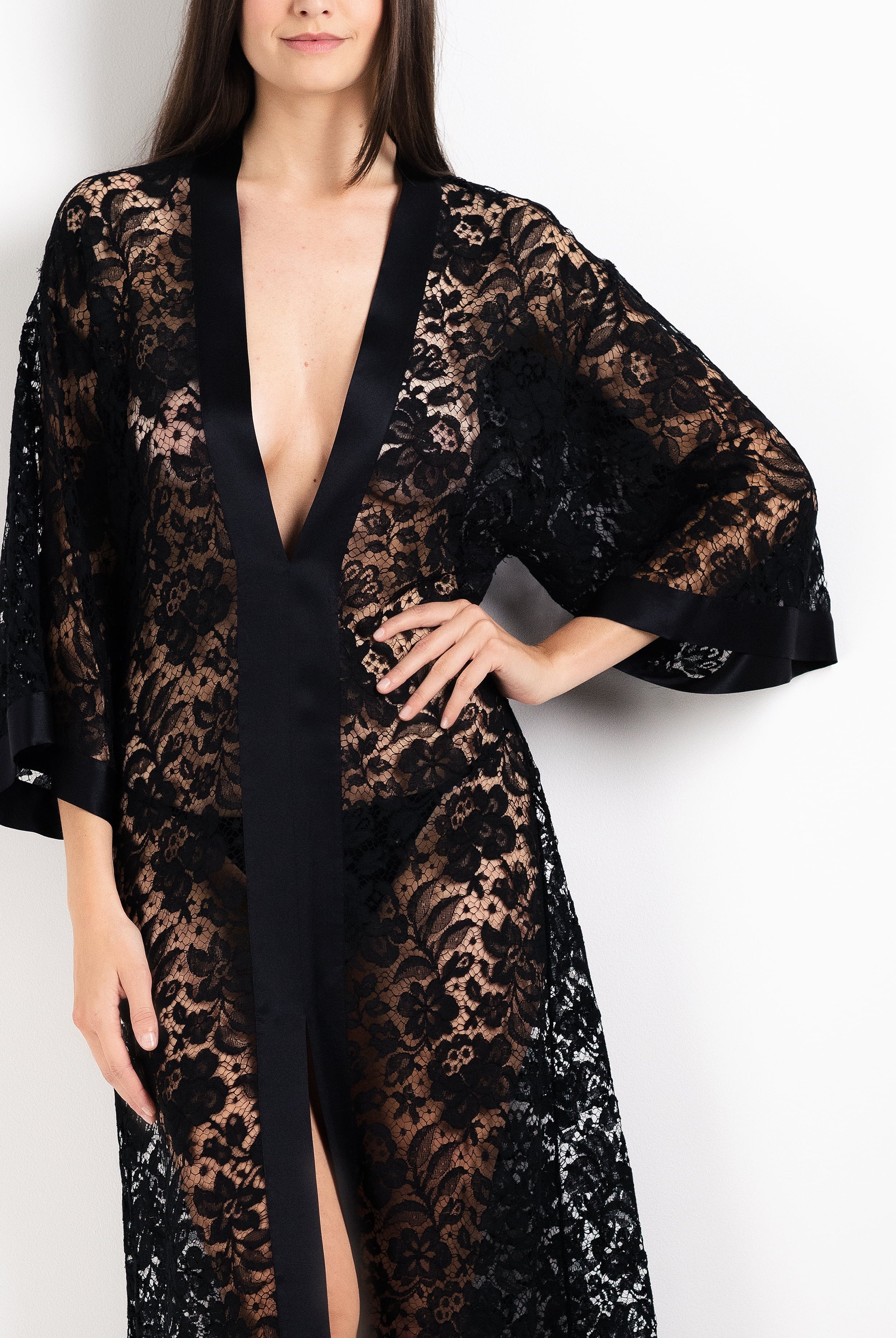 Discover the unique craftmanship of the belgian designer Carine Gilson in her atelier for the 2026 Cruise collection with this Long V Neck Kaftan in black Silk with black lace