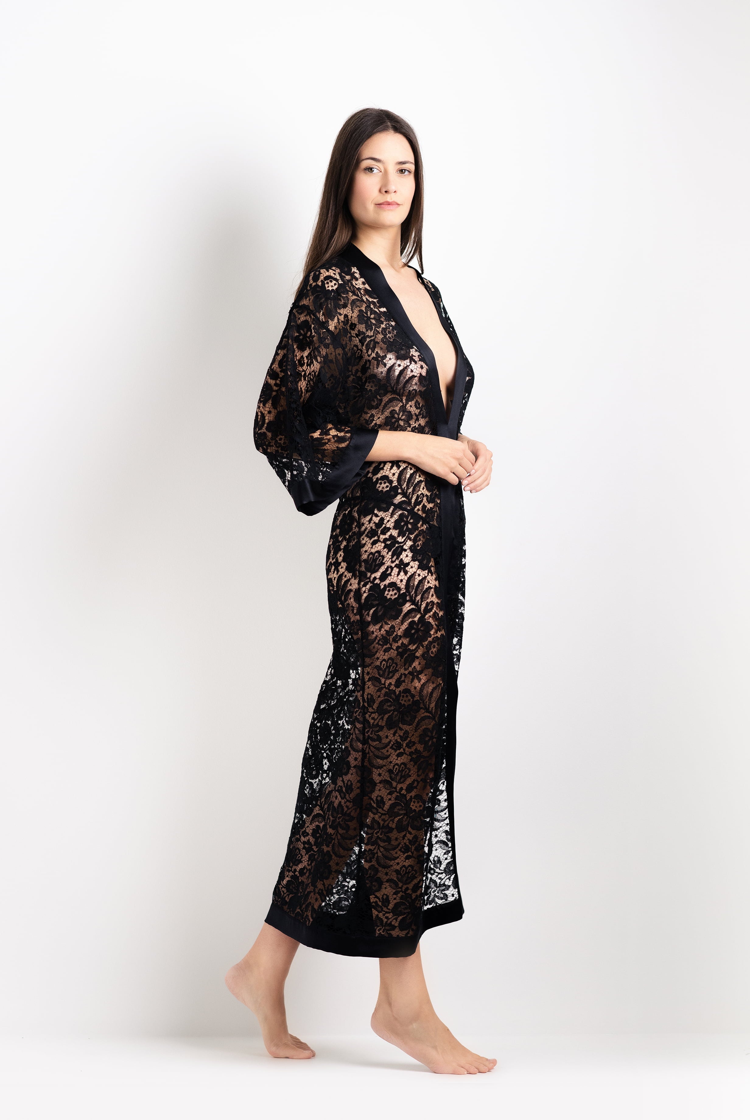 Discover the unique craftmanship of the belgian designer Carine Gilson in her atelier for the 2026 Cruise collection with this Long V Neck Kaftan in black Silk with black lace