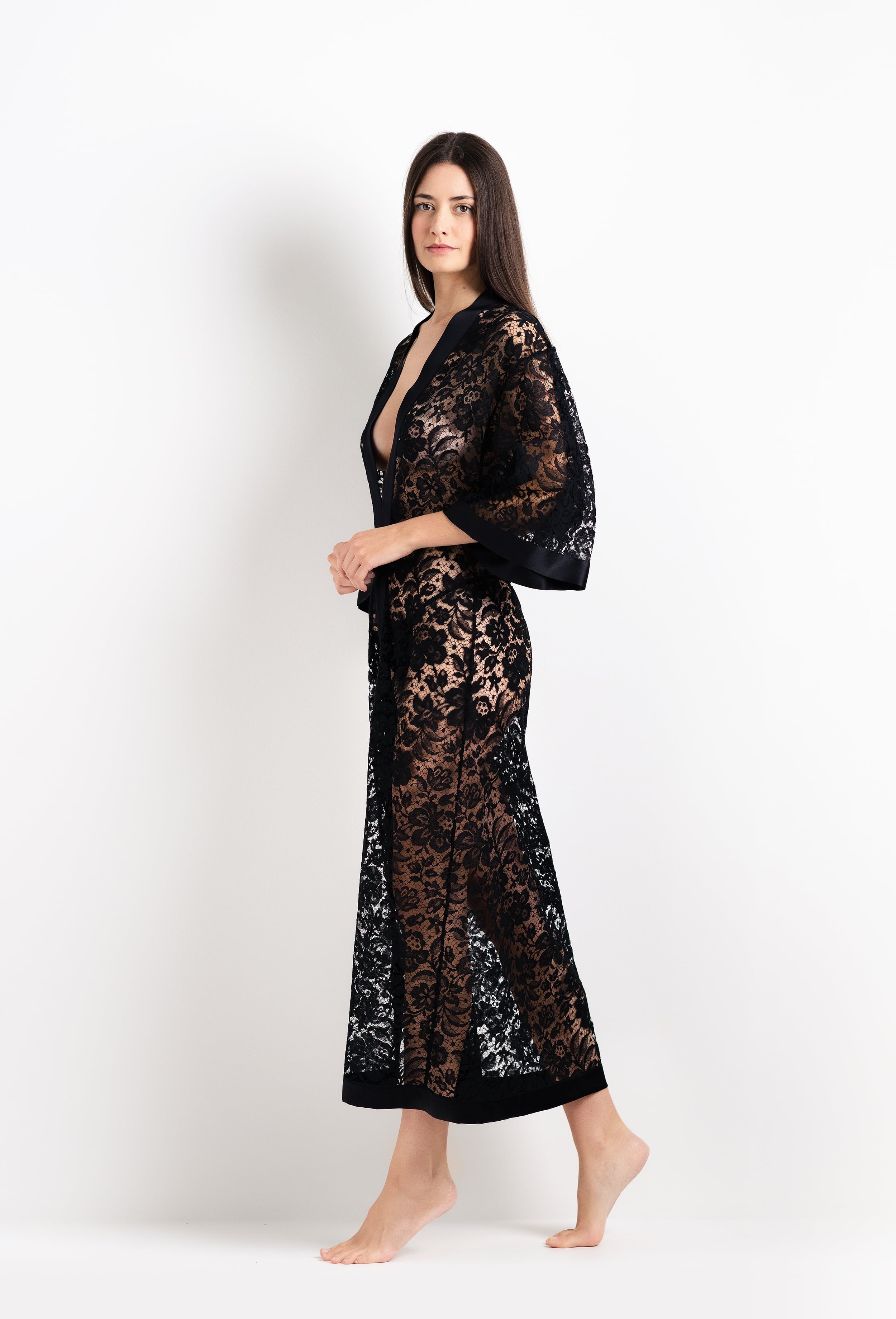 Discover the unique craftmanship of the belgian designer Carine Gilson in her atelier for the 2026 Cruise collection with this Long V Neck Kaftan in black Silk with black lace