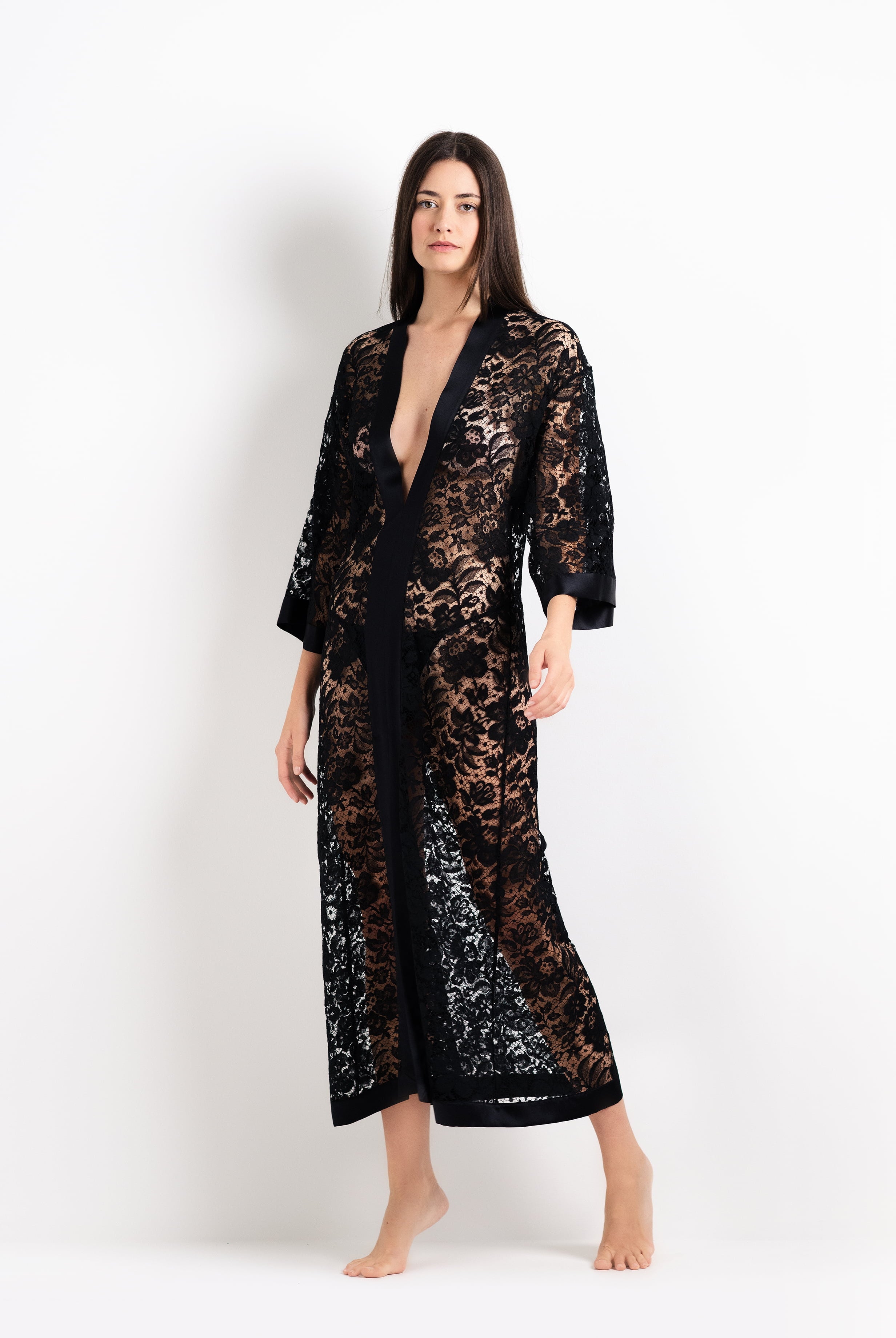 Discover the unique craftmanship of the belgian designer Carine Gilson in her atelier for the 2026 Cruise collection with this Long V Neck Kaftan in black Silk with black lace