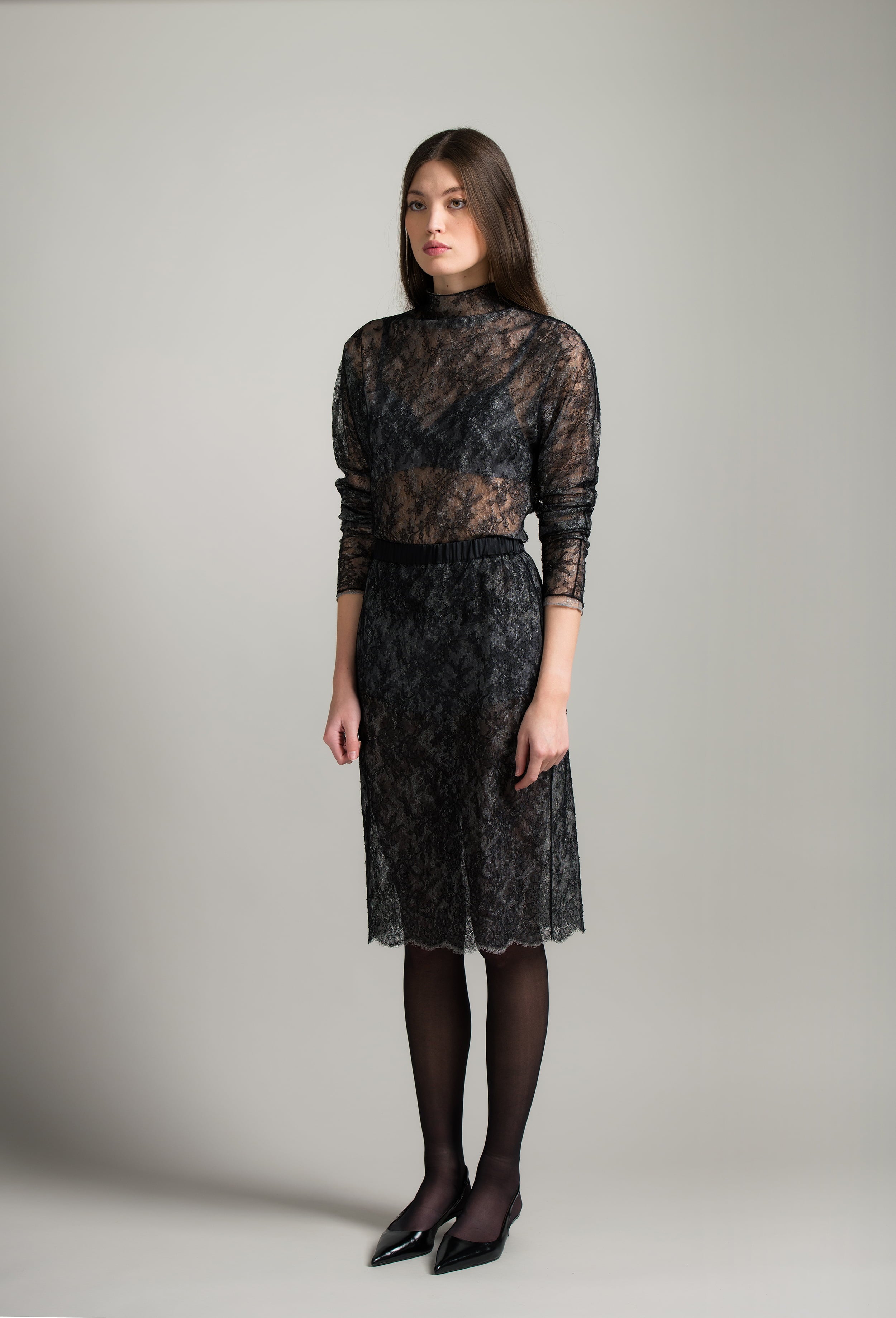 The Winter 2026-27 collection from the house Carine Gilson - The most beautiful couture lingerie to be discovered with this sleeves top in Grey and black lace