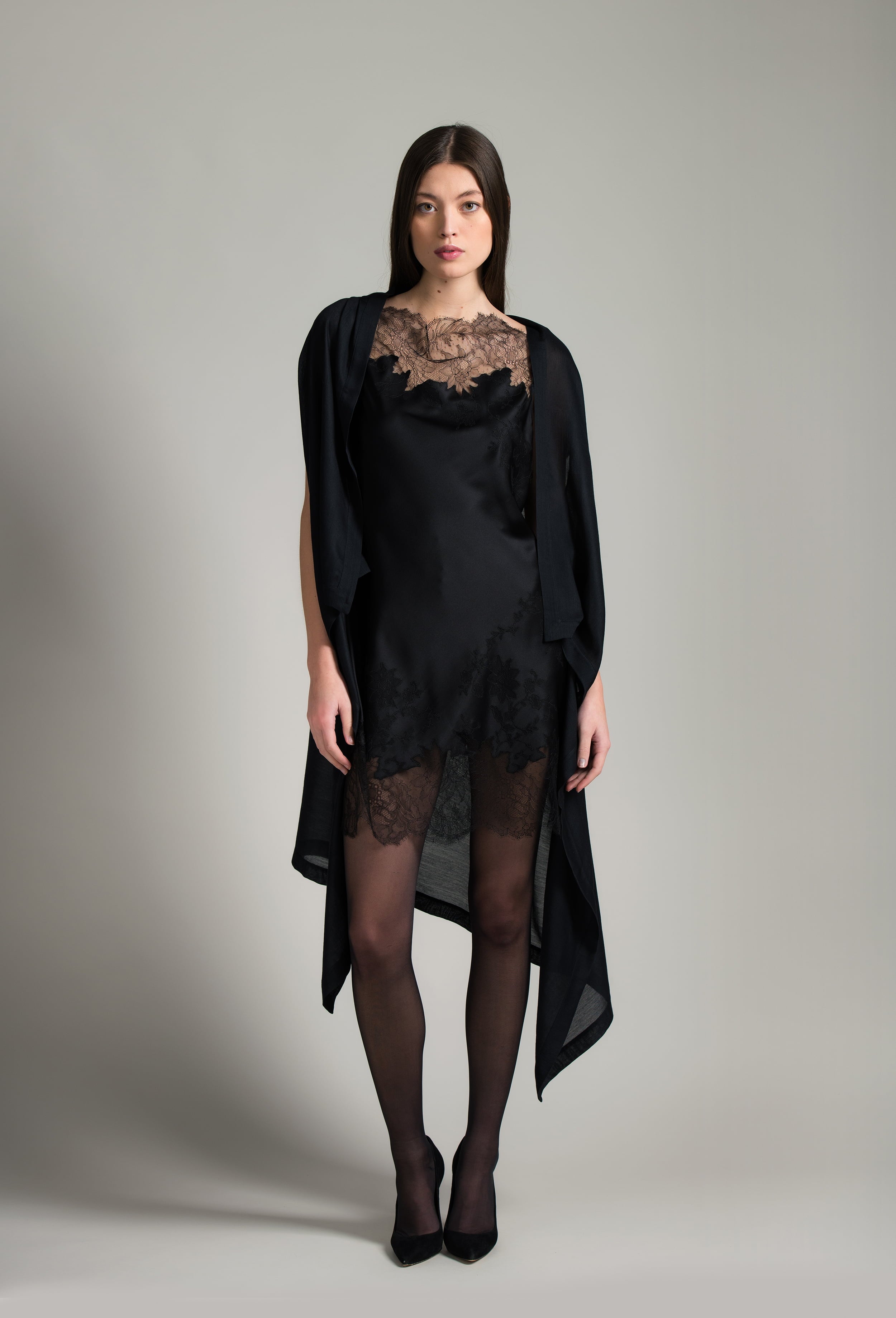 The Winter 2026-27 collection from the house Carine Gilson - The most beautiful couture lingerie to be discovered with this Midi dress with Cowl Neckline with lace in Black Silk with Black lace