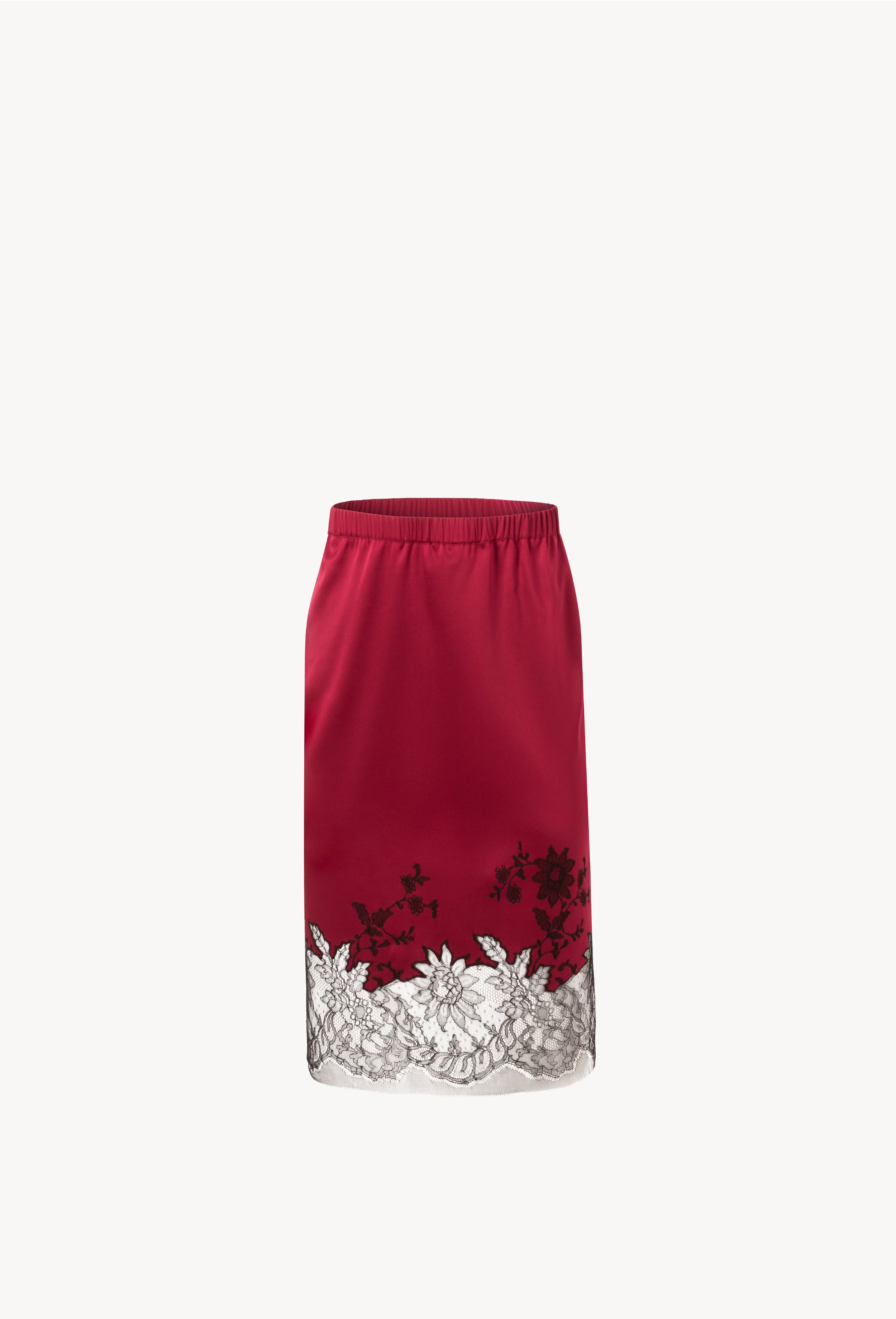 Discover the unique craftmanship of the belgian designer Carine Gilson in her atelier for the Winter 2026-27 collection with this Straight Skirt in Rubis red Silk with Black lace