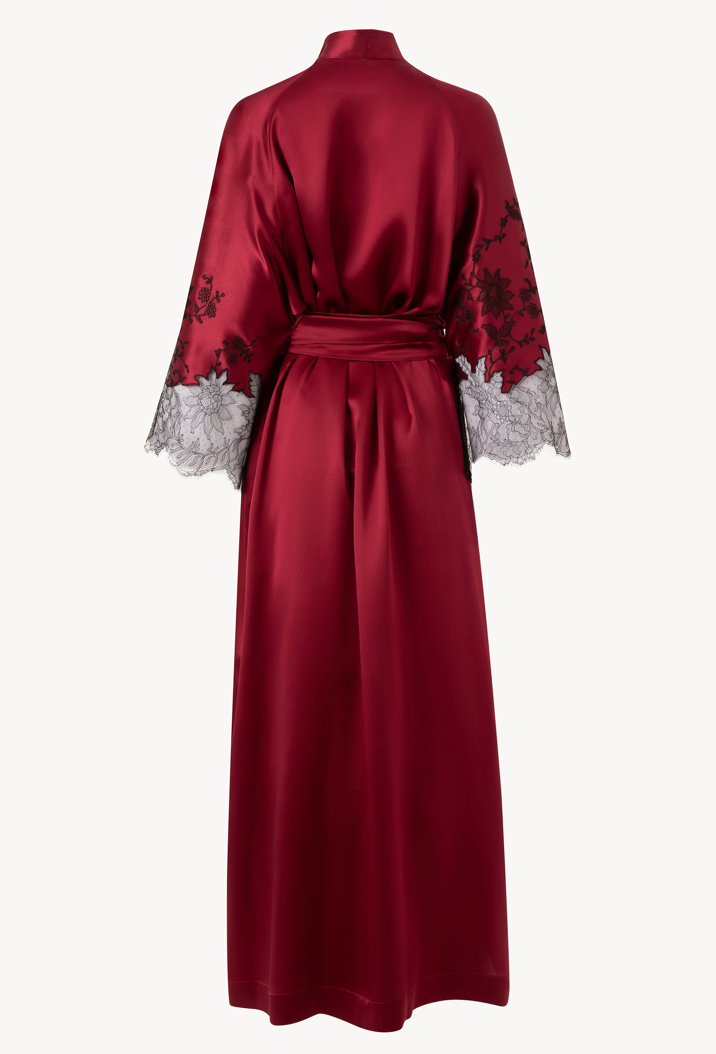 Discover the unique craftmanship of the belgian designer Carine Gilson in her atelier for the Winter 2026-27 collection with this Long Kimono Raglan Style in Rubis red Silk with Black lace