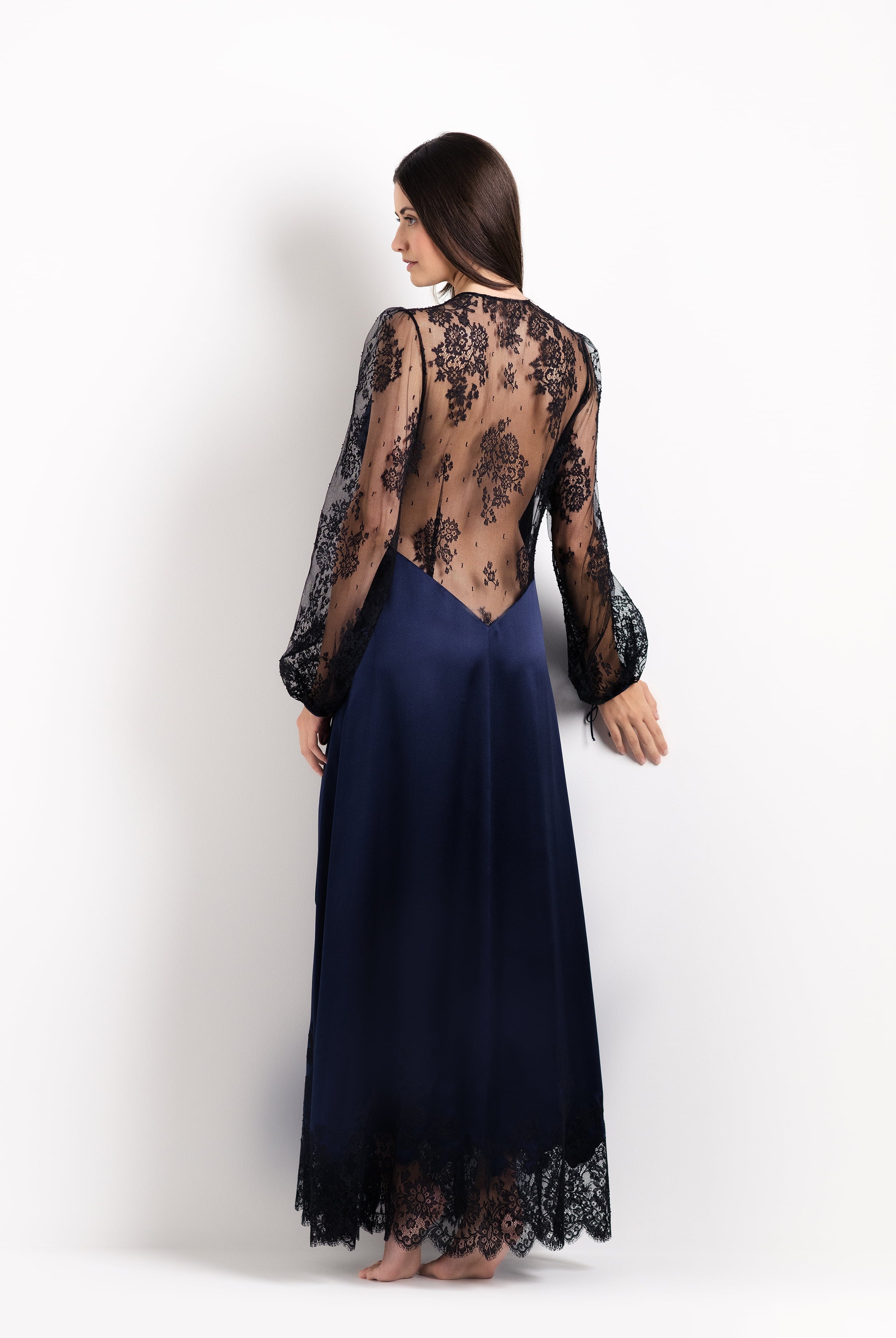 Discover the unique craftmanship of the belgian designer Carine Gilson in her atelier for the 2026 Cruise collection with this Long Déshabillé Cache-Coeur Style Silk Satin in Dark Marine Blue Silk with black lace