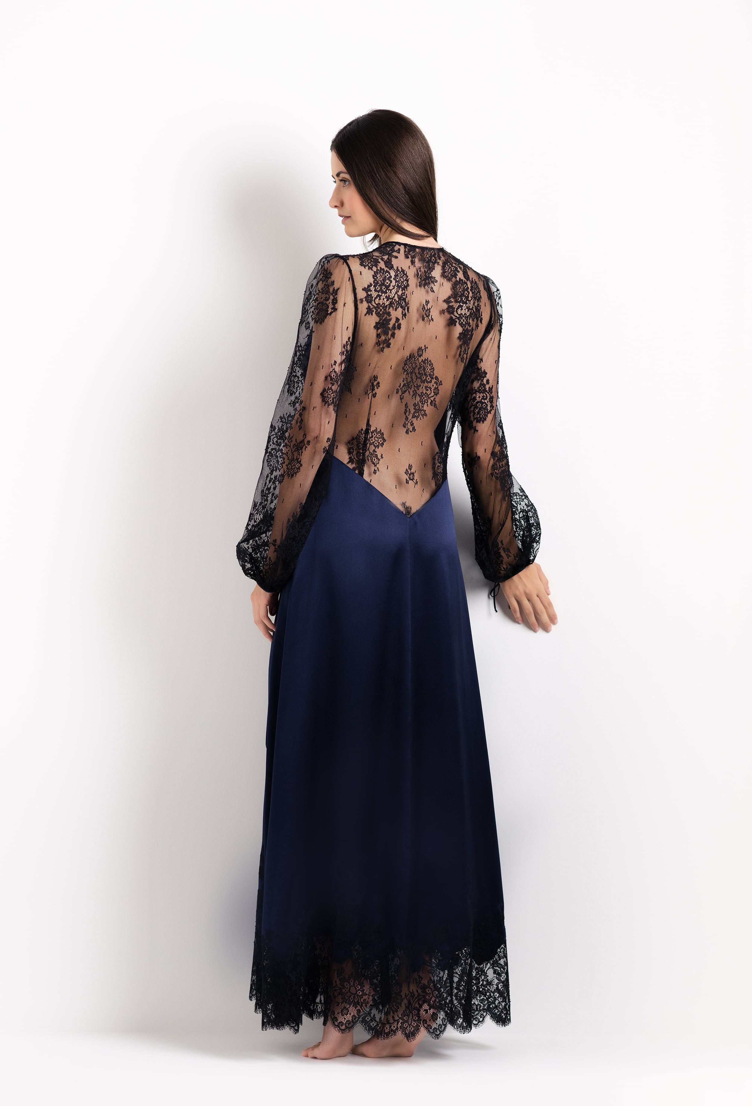 Discover the unique craftmanship of the belgian designer Carine Gilson in her atelier for the 2026 Cruise collection with this Long Déshabillé Cache-Coeur Style Silk Satin in Dark Marine Blue Silk with black lace