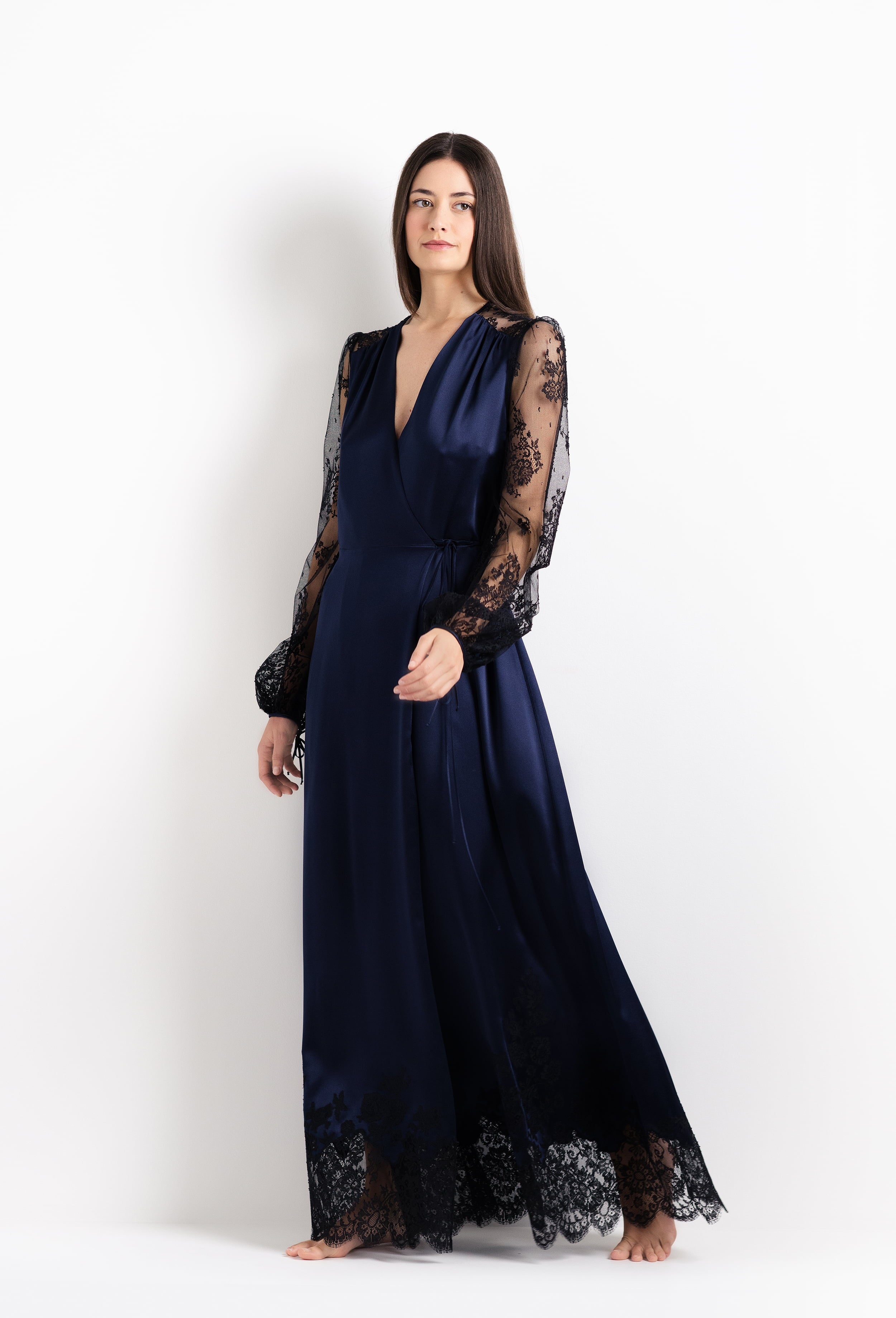 Discover the unique craftmanship of the belgian designer Carine Gilson in her atelier for the 2026 Cruise collection with this Long Déshabillé Cache-Coeur Style Silk Satin in Dark Marine Blue Silk with black lace