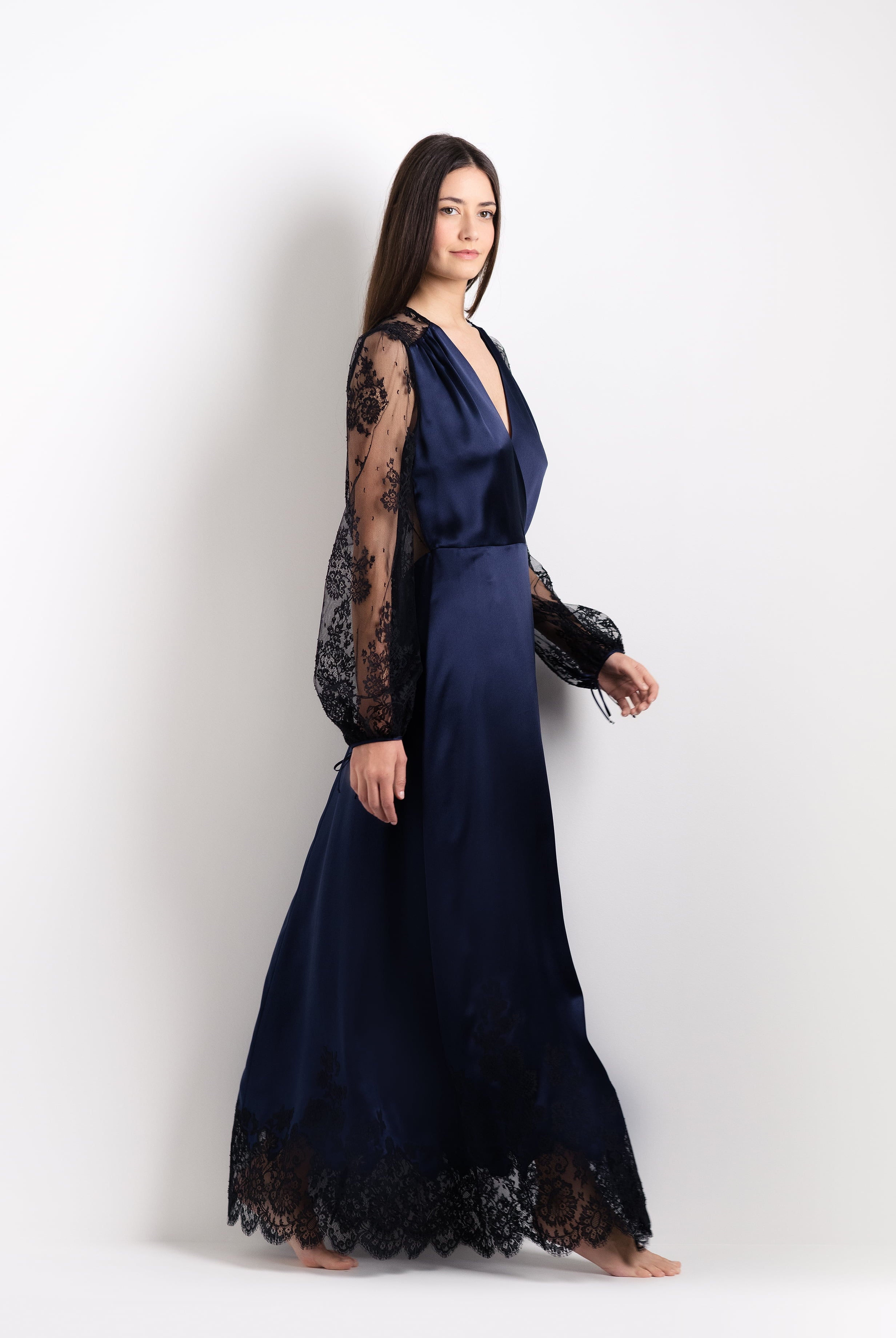 Discover the unique craftmanship of the belgian designer Carine Gilson in her atelier for the 2026 Cruise collection with this Long Déshabillé Cache-Coeur Style Silk Satin in Dark Marine Blue Silk with black lace