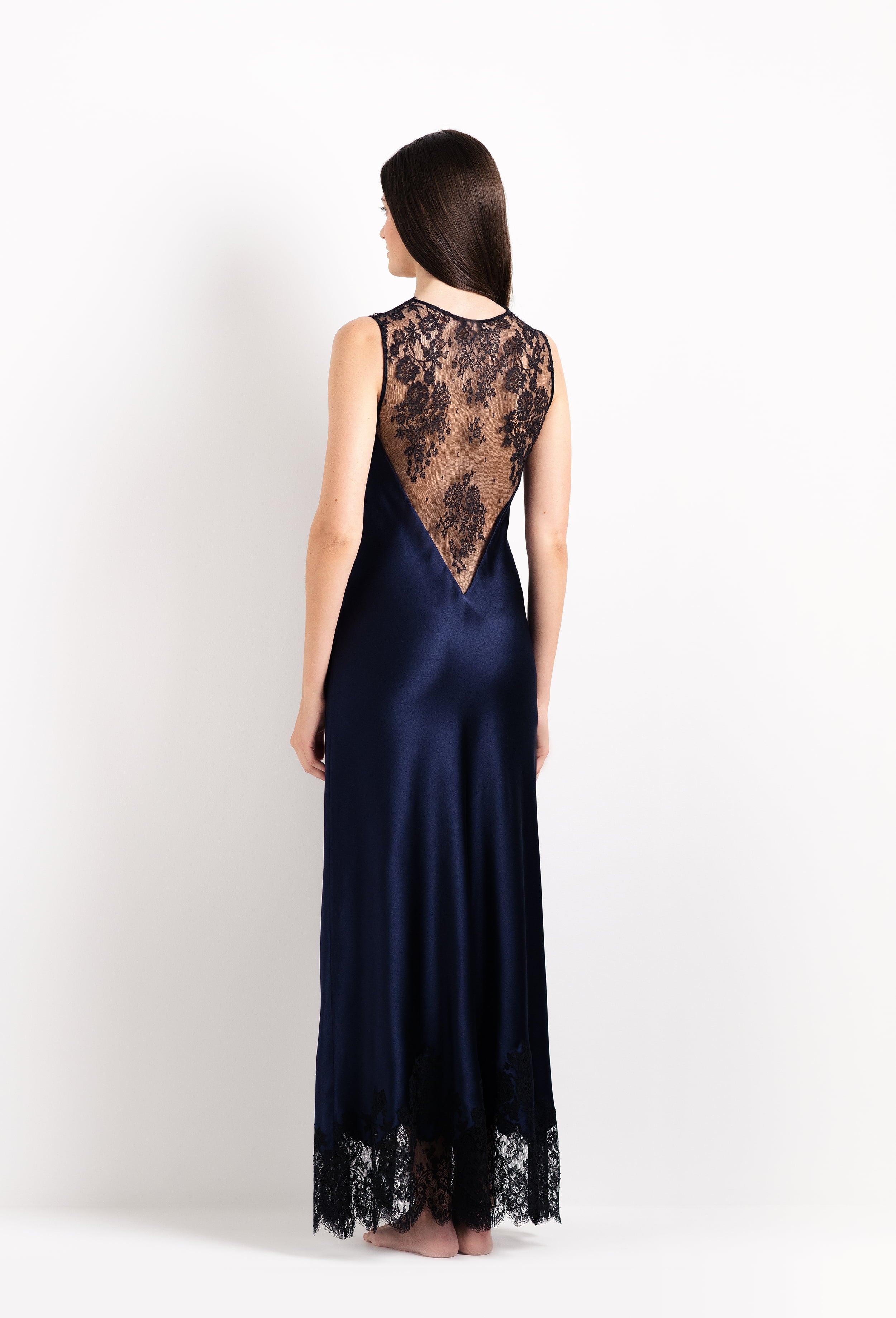 Enjoy the 2026 Cruise collection from the house Carine Gilson with this Long Gown V Neckline in Dark Marine Blue Silk with black lace