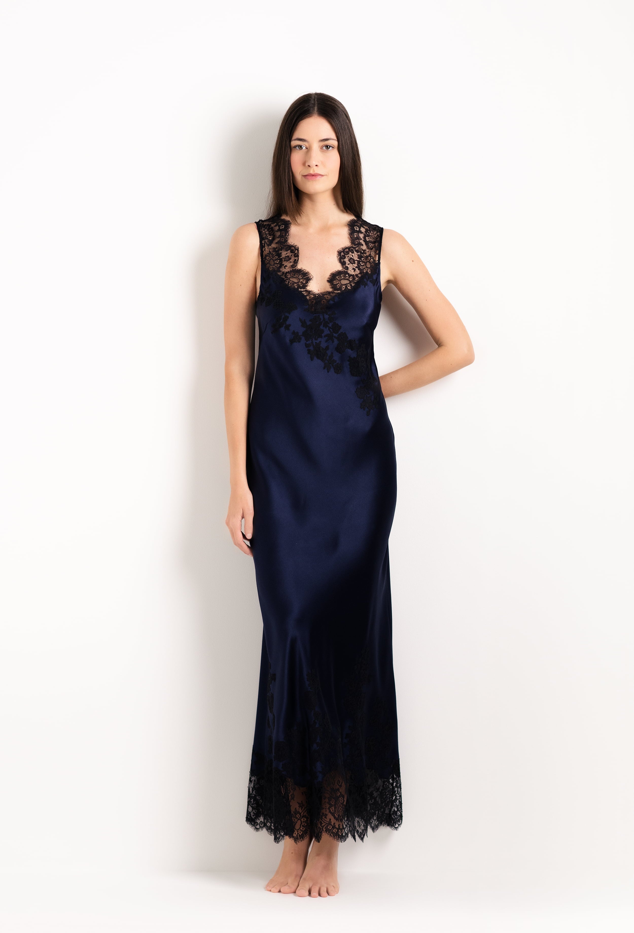 Enjoy the 2026 Cruise collection from the house Carine Gilson with this Long Gown V Neckline in Dark Marine Blue Silk with black lace