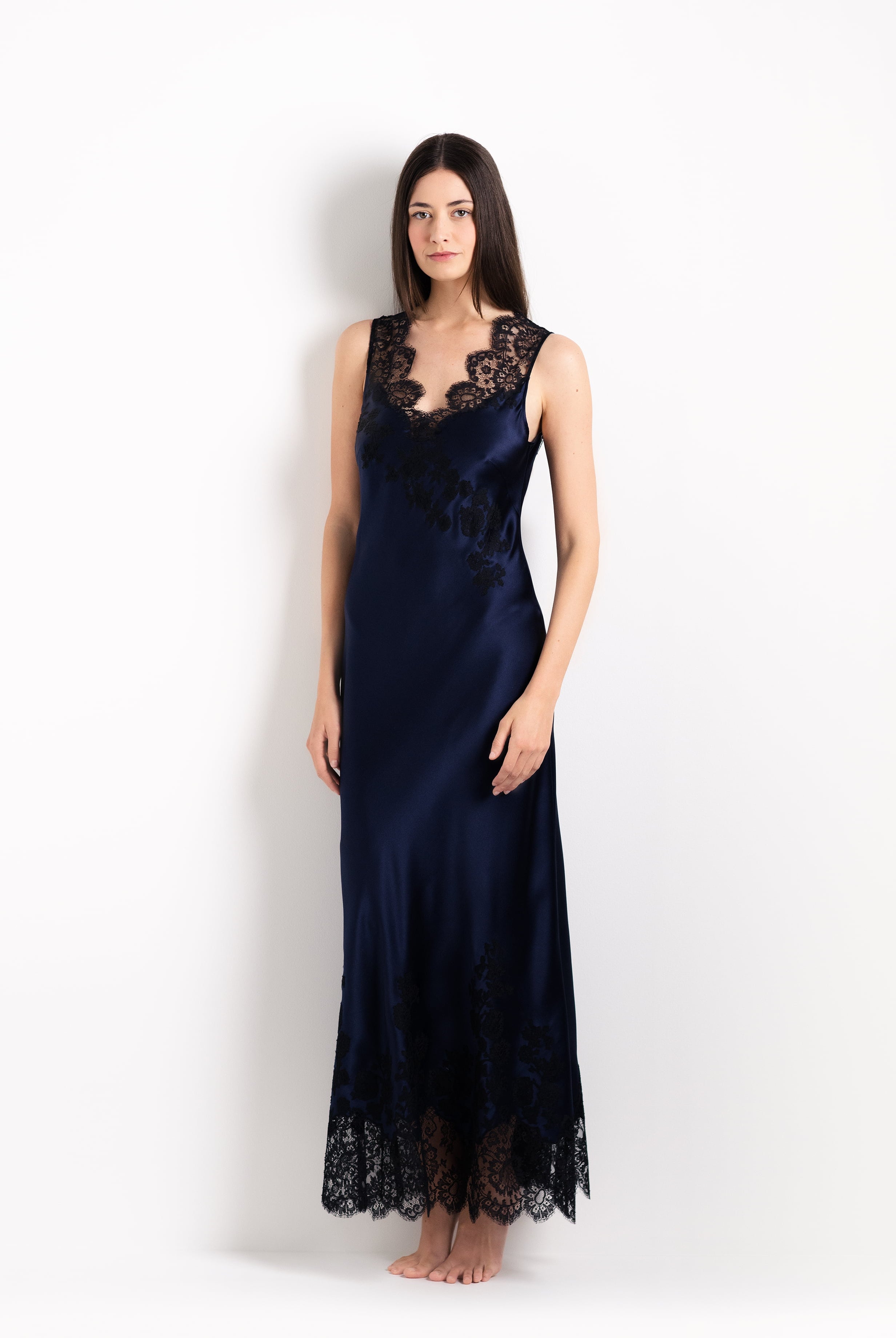 Enjoy the 2026 Cruise collection from the house Carine Gilson with this Long Gown V Neckline in Dark Marine Blue Silk with black lace