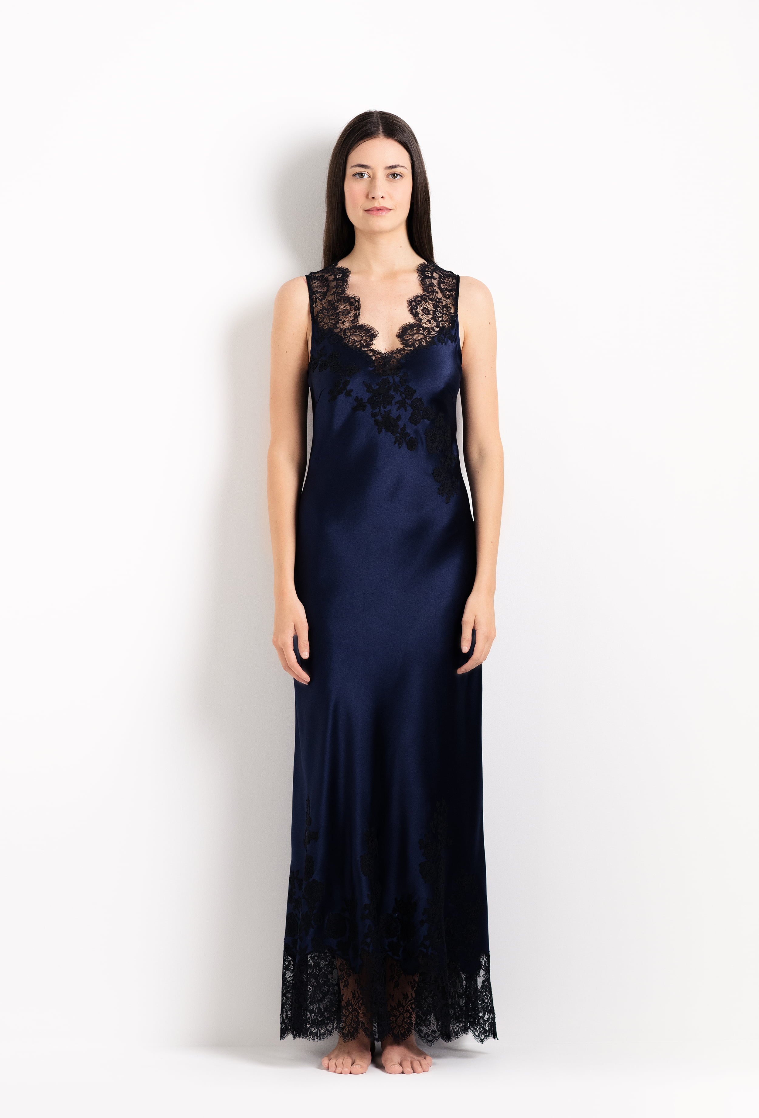 Enjoy the 2026 Cruise collection from the house Carine Gilson with this Long Gown V Neckline in Dark Marine Blue Silk with black lace