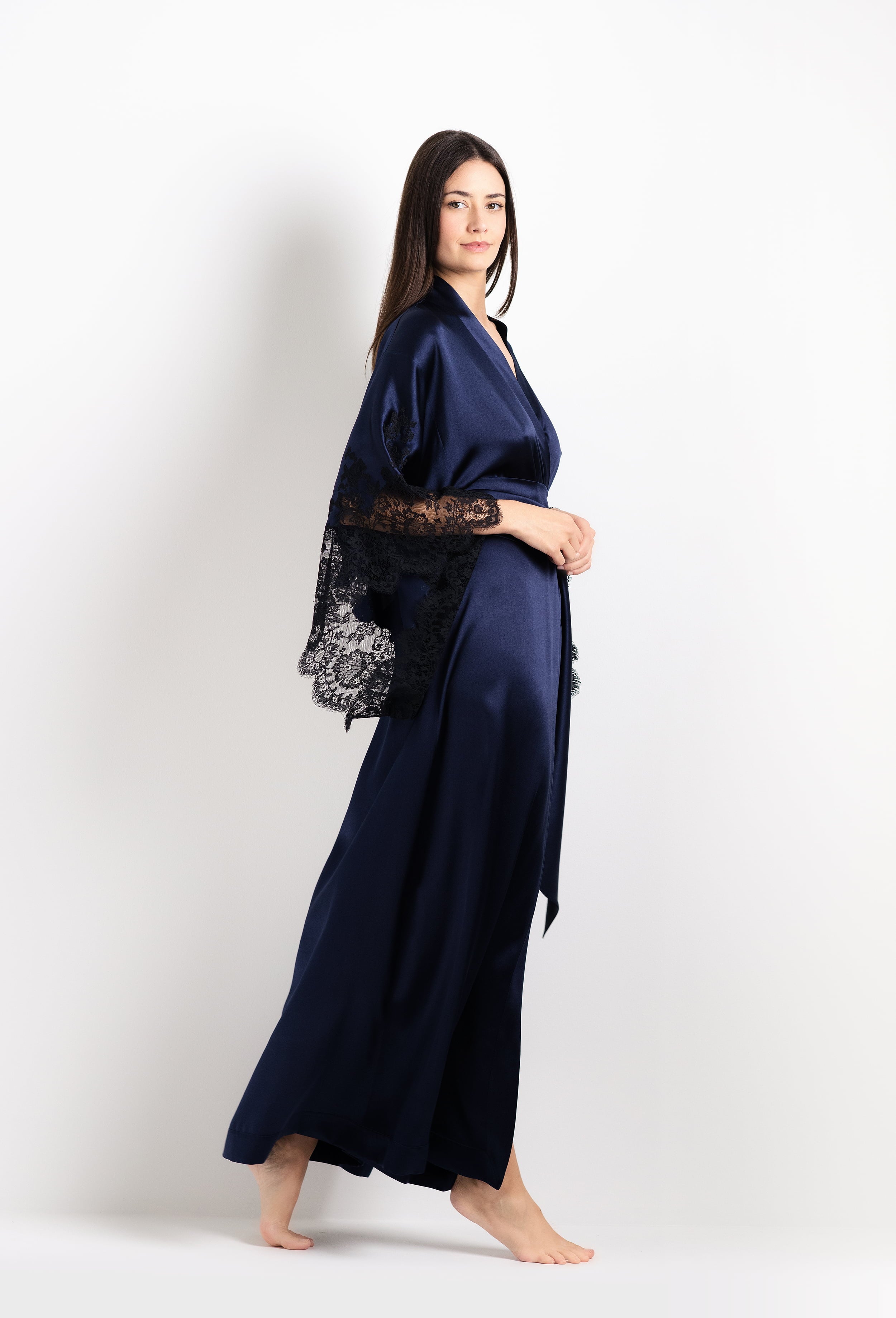 Discover the 2026 Cruise collection of silk and lace couture from the house Carine Gilson with this Long Kimono Butterfly Sleeves in Dark Marine Blue Silk with black lace