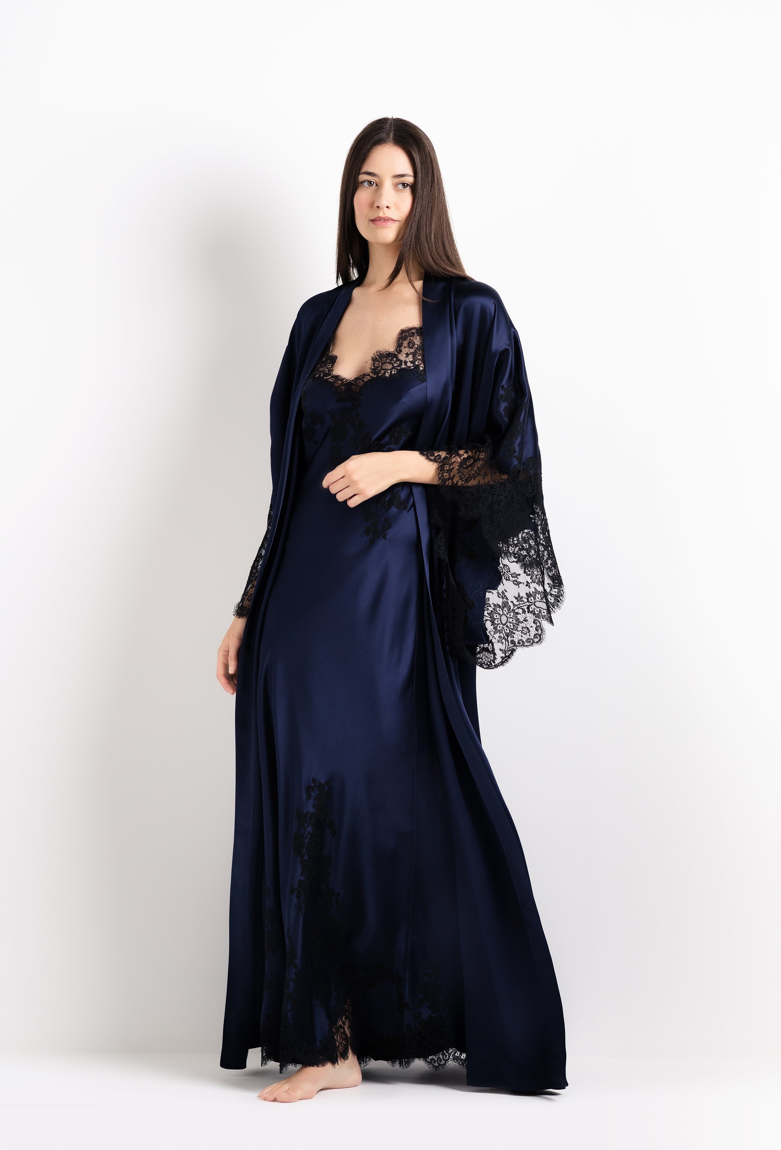 Discover the 2026 Cruise collection of silk and lace couture from the house Carine Gilson with this Long Kimono Butterfly Sleeves in Dark Marine Blue Silk with black lace