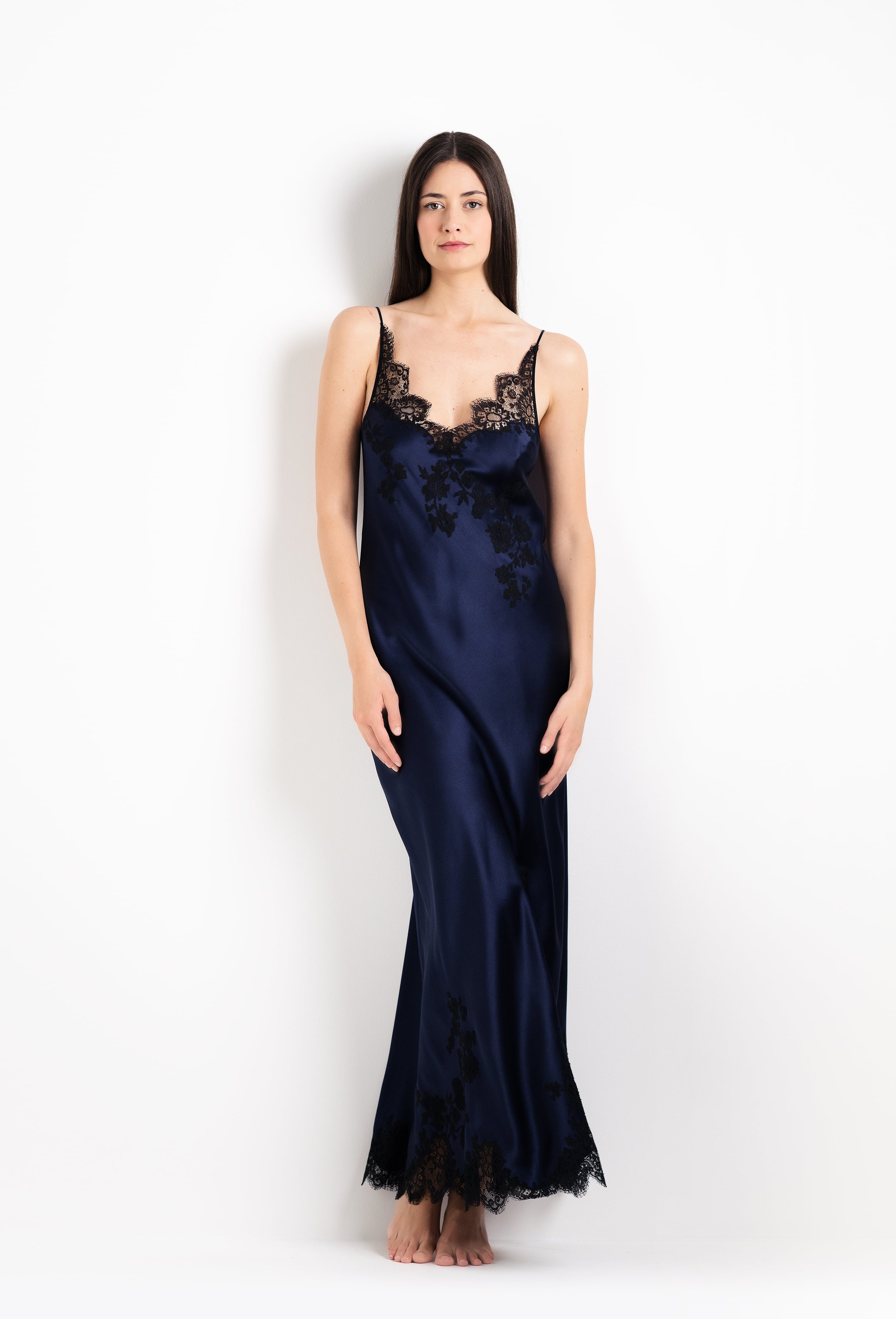 Made of silk and lace, explore the 2026 Cruise collection from the house Carine Gilson with this Long Gown V Neckline in Dark Marine Blue Silk with black lace