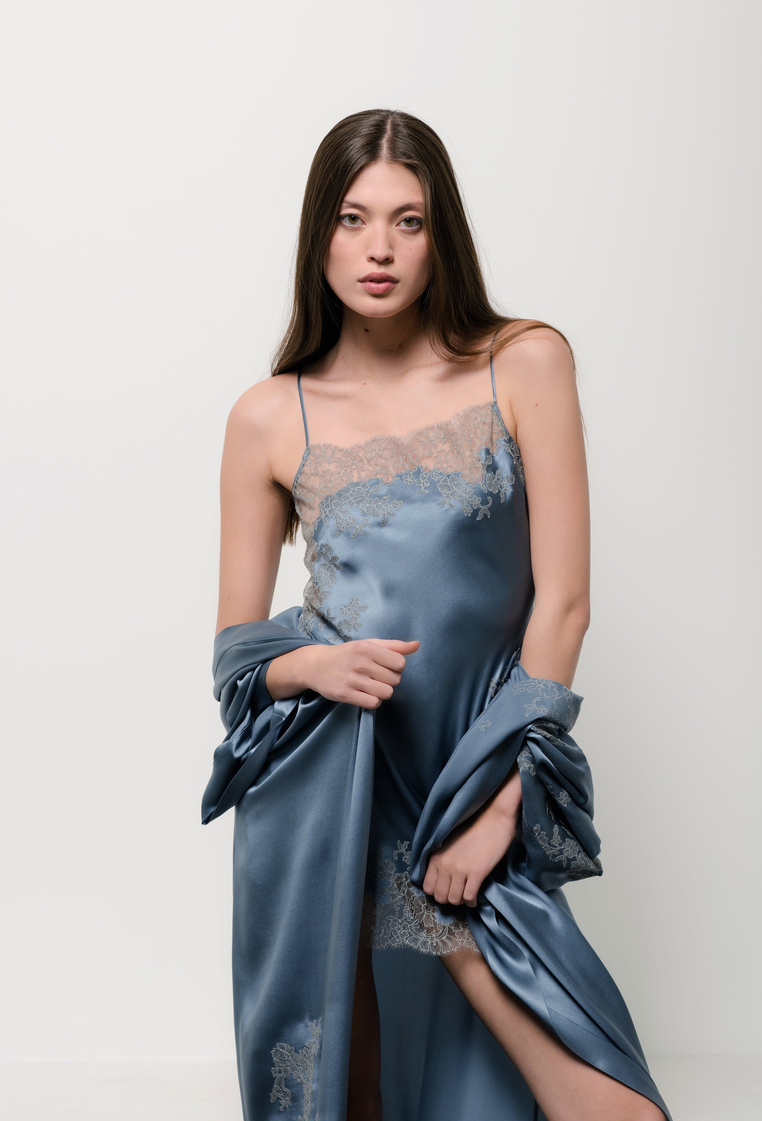 The Hiver 2026-27 collection from the house Carine Gilson - The most beautiful couture lingerie to be discovered with this babydoll style straight neckline in blue stone silk with grey lace