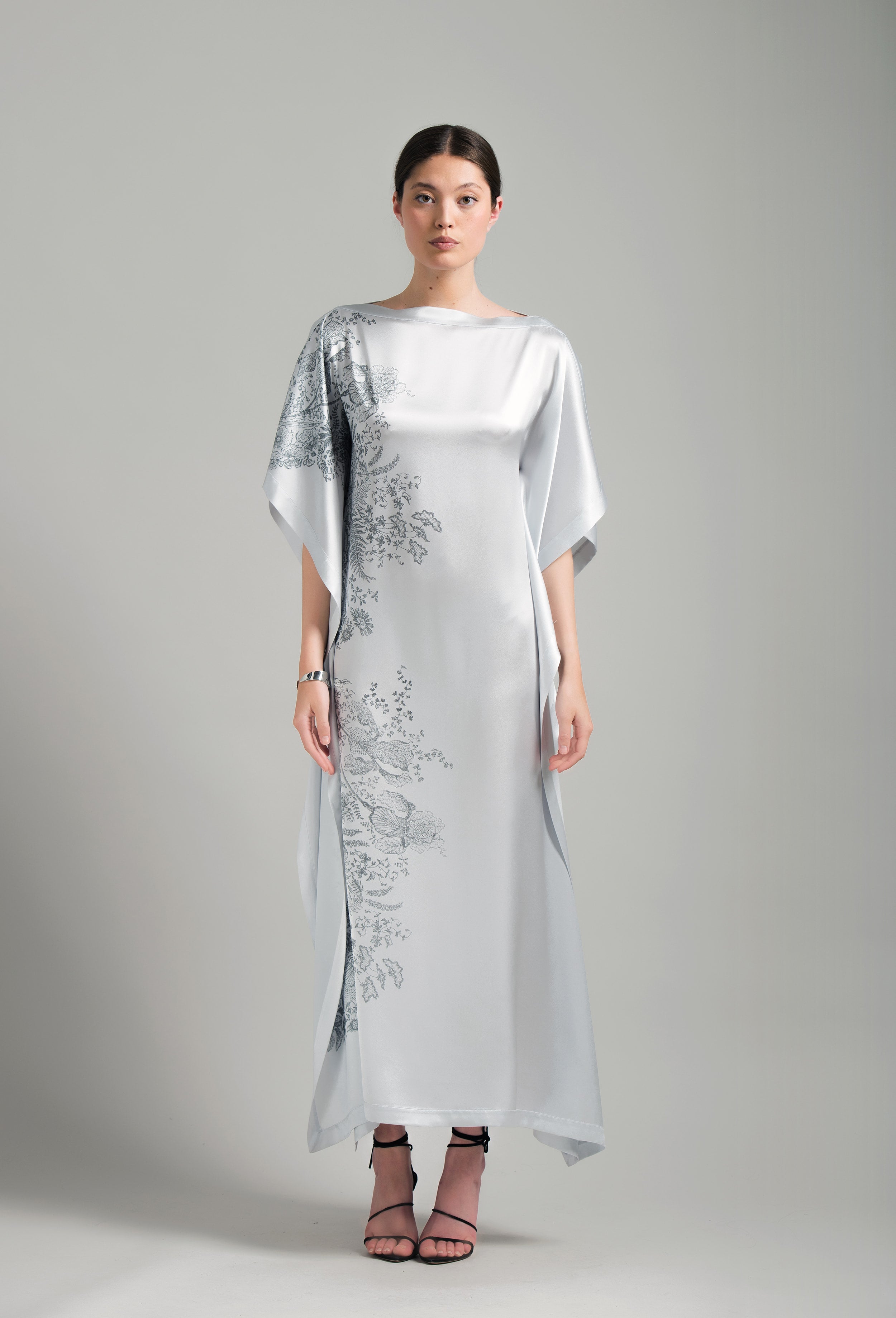 The Hiver 2026-27 collection from the house Carine Gilson - The most beautiful couture lingerie to be discovered with this Long Kaftan Dress with 2 Silk Carre in Silver print Silk