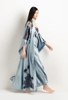 Discover the unique craftmanship of the belgian designer Carine Gilson in her atelier for the 2025 Winter collection with this Long Kimono Butterfly Sleeves in Frozen blue Silk  with Ebony lace
