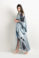 Discover the unique craftmanship of the belgian designer Carine Gilson in her atelier for the 2025 Winter collection with this Long Kimono Butterfly Sleeves in Frozen blue Silk  with Ebony lace