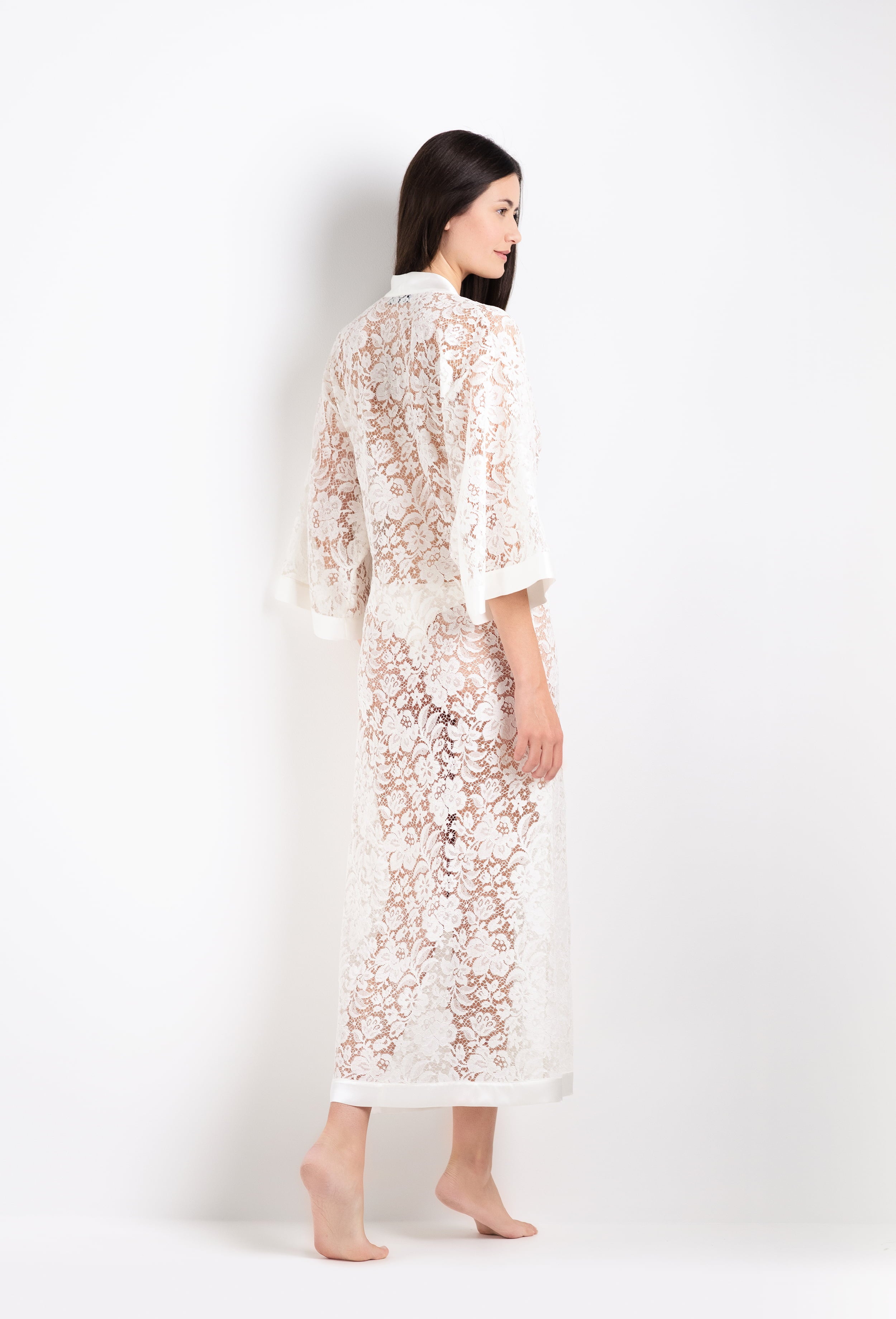 Discover the 2026 Cruise collection of lingerie couture from the house Carine Gilson with this long v neck kaftan in natural silk with natural lace