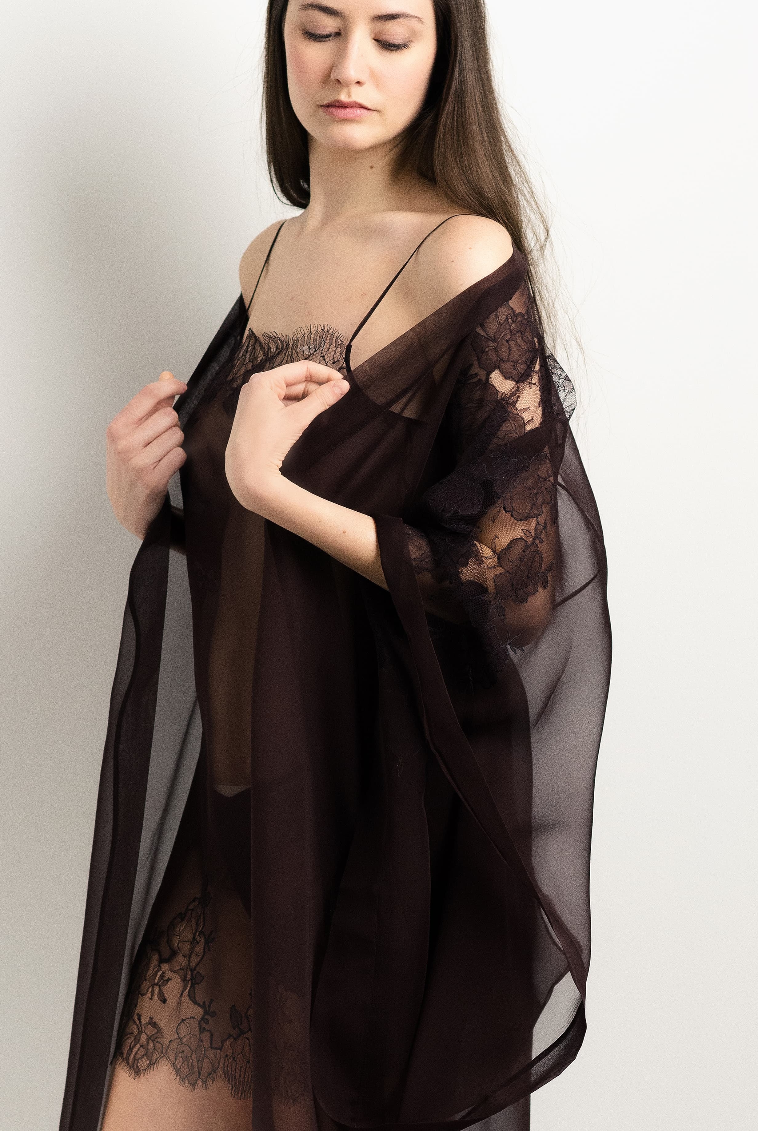 Discover the 2025 Winter collection of lingerie couture from the house Carine Gilson with this Long Kimono Butterfly Sleeves in Ebony Silk with Ebony lace