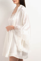 Made of silk and lace, explore the lingerie collection 2025 Summer from the house Carine Gilson with this Short Kimono Butterfly Sleeves in Natural Silk  with Natural lace
