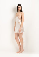 Discover the unique craftmanship of the belgian designer Carine Gilson in her atelier for the 2025 Winter collection with this Slip Babydoll Style Straight Neckline in ivory Silk  with Vison lace