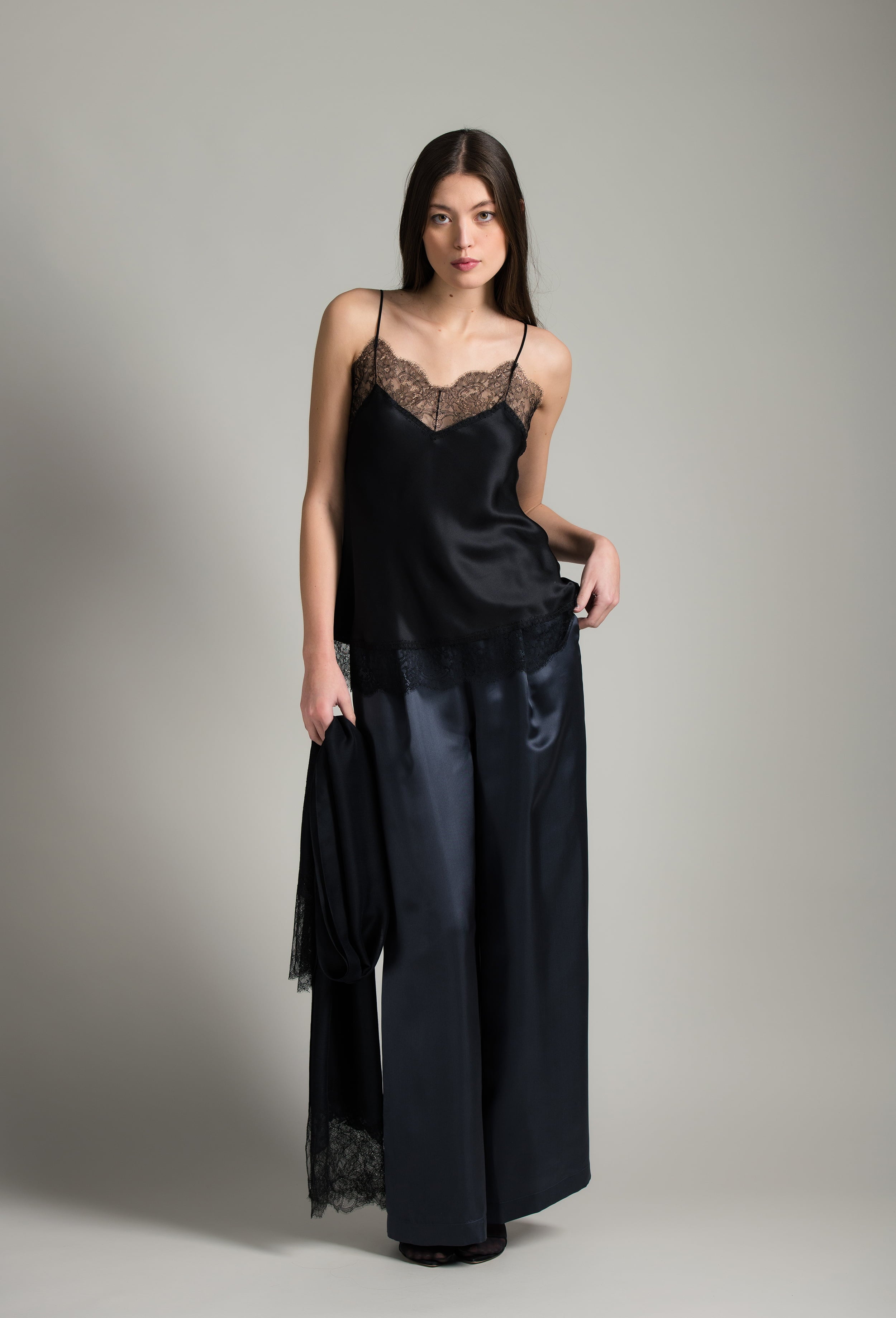 The Winter 2026-27 collection from the house Carine Gilson - The most beautiful couture lingerie to be discovered with this Long Top V Neckline with cuts in black Silk with black lace