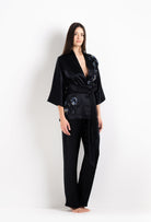 Discover the unique craftmanship of the belgian designer Carine Gilson in her atelier for the 2026 Cruise collection with this Short Kimono Raglan Style in black Silk  with Sparkling black lace