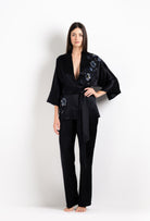 Discover the unique craftmanship of the belgian designer Carine Gilson in her atelier for the 2026 Cruise collection with this Short Kimono Raglan Style in black Silk  with Sparkling black lace
