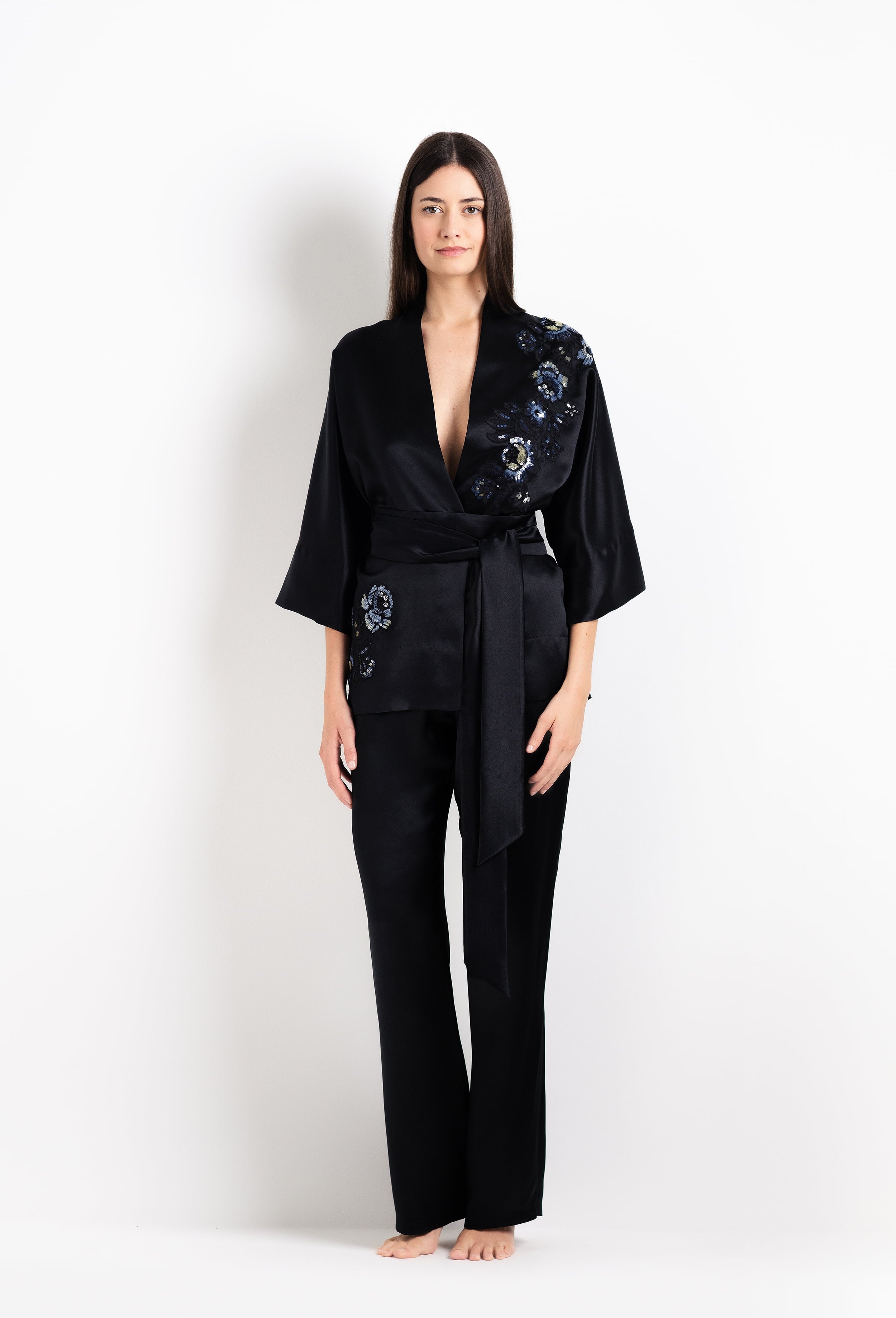 Discover the unique craftmanship of the belgian designer Carine Gilson in her atelier for the 2026 Cruise collection with this Short Kimono Raglan Style in black Silk  with Sparkling black lace