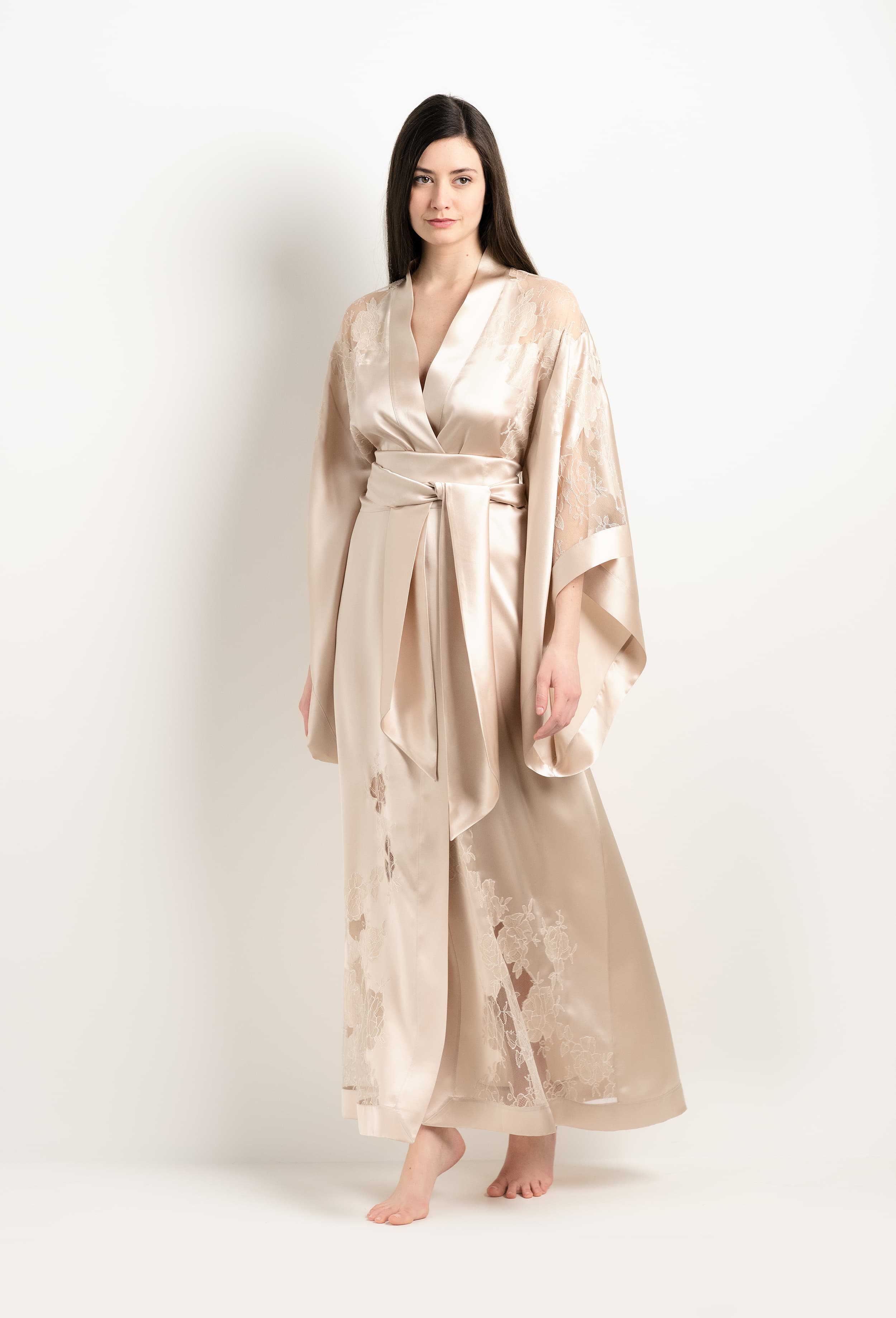 Discover the unique craftmanship of the belgian designer Carine Gilson in her atelier for the 2025 Winter collection with this Long Kimono Butterfly Sleeves in sand beige Silk  with ivory lace