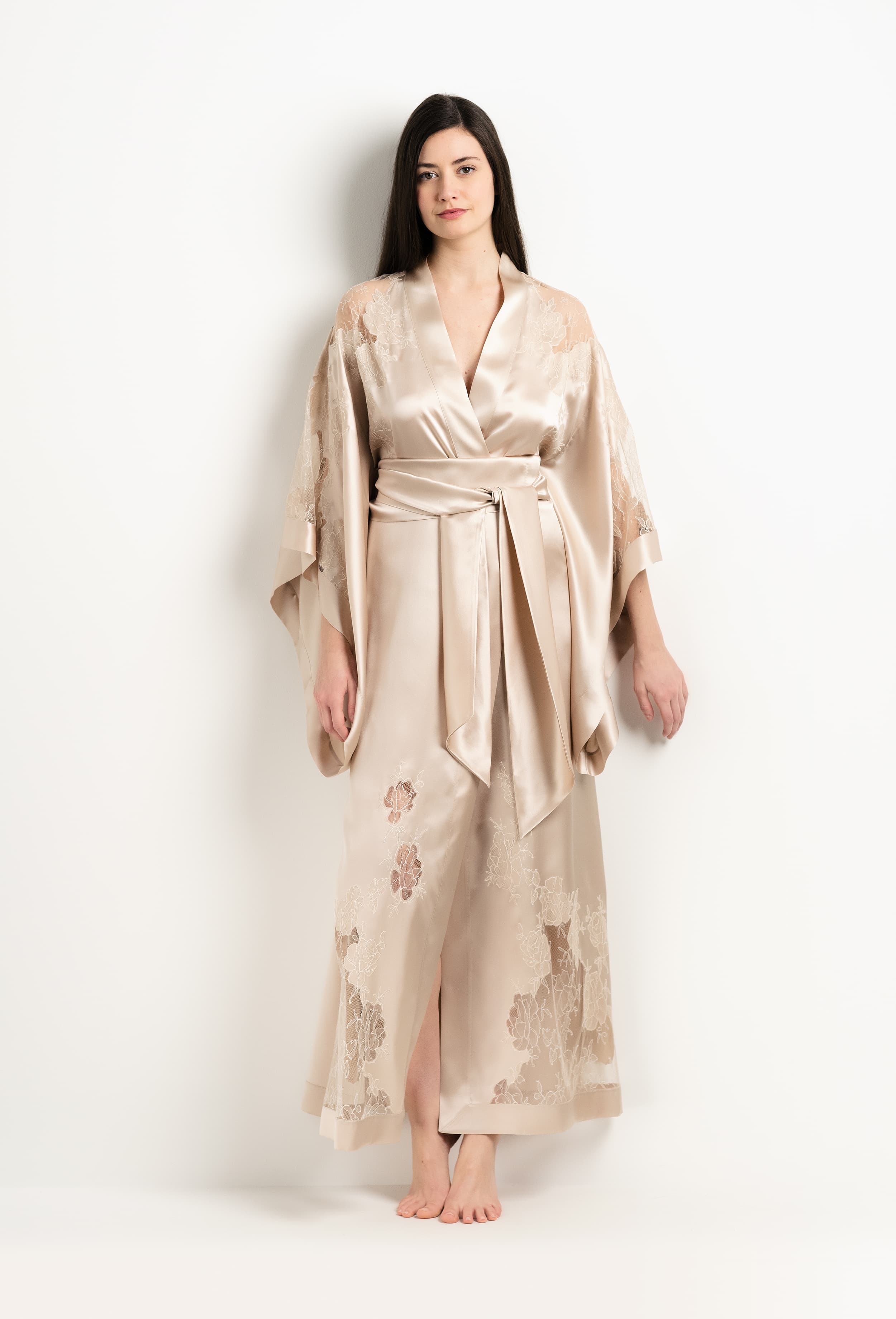 Discover the unique craftmanship of the belgian designer Carine Gilson in her atelier for the 2025 Winter collection with this Long Kimono Butterfly Sleeves in sand beige Silk  with ivory lace