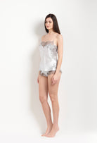 Discover the unique craftmanship of the belgian designer Carine Gilson in her atelier for the Hiver 2026-27 collection with this camisole straight neckline in silver grey silk  with grey lace