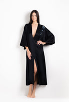 Enter Carine Gilson's world and the most beautiful silk and lace collection with the 2026 Cruise with this Long V Neck Kaftan in black Silk  with Sparkling black lace