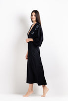 Enter Carine Gilson's world and the most beautiful silk and lace collection with the 2026 Cruise with this Long V Neck Kaftan in black Silk  with Sparkling black lace