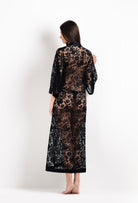Discover the unique craftmanship of the belgian designer Carine Gilson in her atelier for the 2026 Cruise collection with this Long V Neck Kaftan in black Silk  with black lace