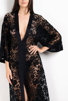 Discover the unique craftmanship of the belgian designer Carine Gilson in her atelier for the 2026 Cruise collection with this Long V Neck Kaftan in black Silk  with black lace