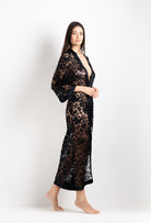 Discover the unique craftmanship of the belgian designer Carine Gilson in her atelier for the 2026 Cruise collection with this Long V Neck Kaftan in black Silk  with black lace