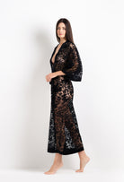 Discover the unique craftmanship of the belgian designer Carine Gilson in her atelier for the 2026 Cruise collection with this Long V Neck Kaftan in black Silk  with black lace