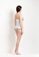 Discover the unique craftmanship of the belgian designer Carine Gilson in her atelier for the Hiver 2026-27 collection with this camisole straight neckline in silver grey silk  with grey lace
