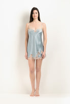 Discover the unique craftmanship of the belgian designer Carine Gilson in her atelier for the 2025 Winter collection with this Slip Babydoll Style V Neckline in Frozen blue Silk  with ivory lace