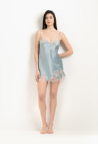 Discover the unique craftmanship of the belgian designer Carine Gilson in her atelier for the 2025 Winter collection with this Slip Babydoll Style V Neckline in Frozen blue Silk  with ivory lace