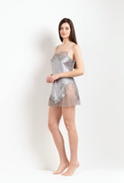 The Hiver 2026-27 collection from the house Carine Gilson - The most beautiful couture lingerie to be discovered with this babydoll style straight neckline in leadgrey silk with grey lace