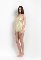 Enjoy the 2026 Summer collection of lingerie couture from the house Carine Gilson with this camisole straight neckline in light yellow silk with acid yellow lace