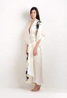 Made of silk and lace, explore the lingerie collection 2025 cruise from the house Carine Gilson with this Long Kimono Short Sleeves in Pearl Silk  with Black lace