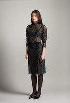 The Winter 2026-27 collection from the house Carine Gilson - The most beautiful couture lingerie to be discovered with this sleeves top in Grey and black lace